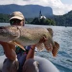 fisher caught pike at lake bled